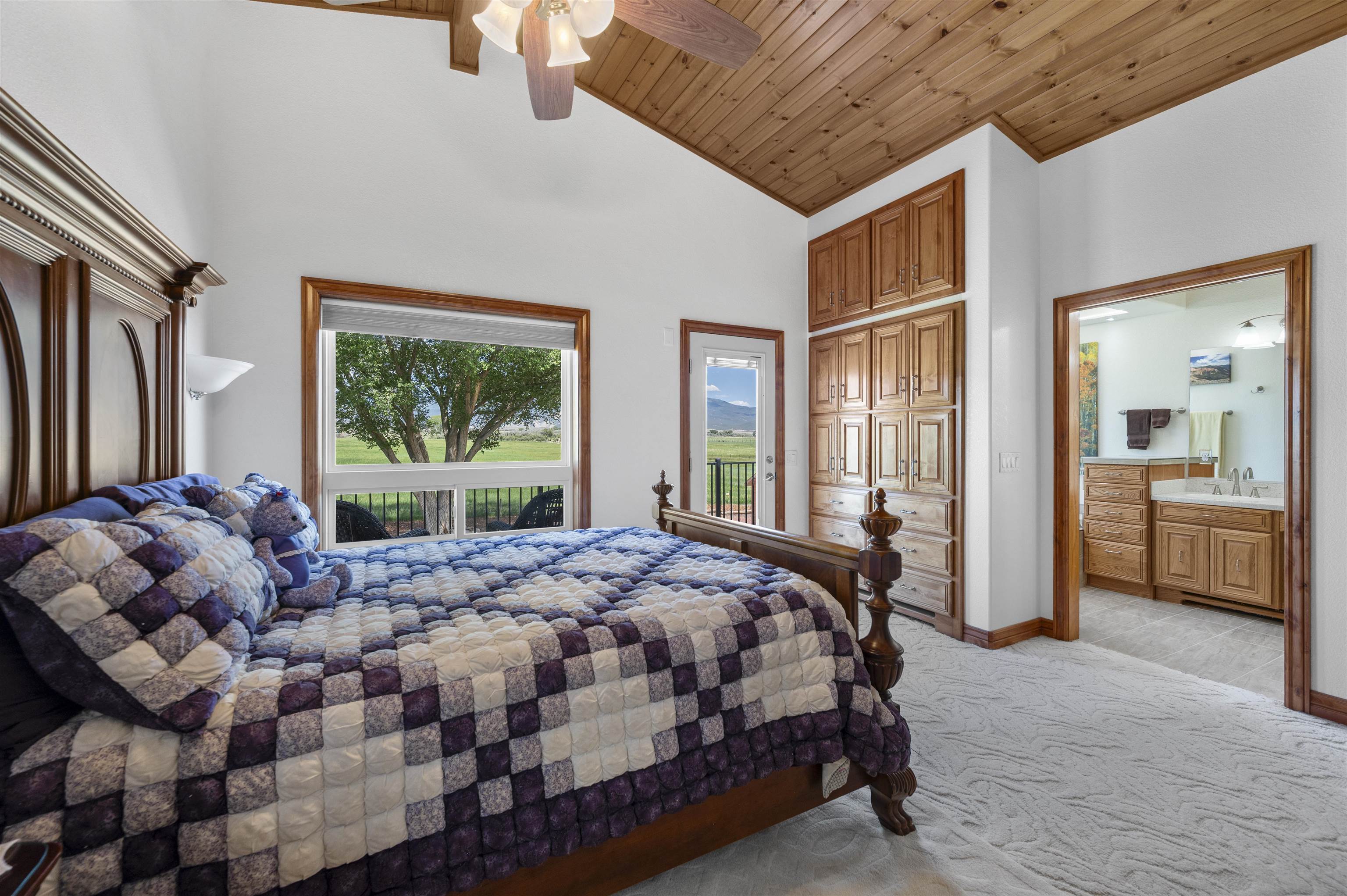 6800 Reeder Mesa Road Whitewater, CO 81527 - Photo 20 of 38 a bedroom with a bed next to a window