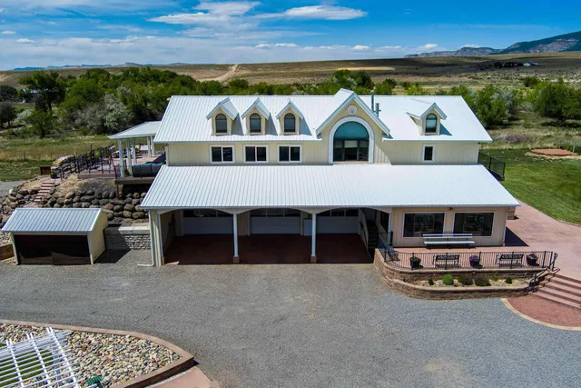 an aerial view of a house with outdoor space