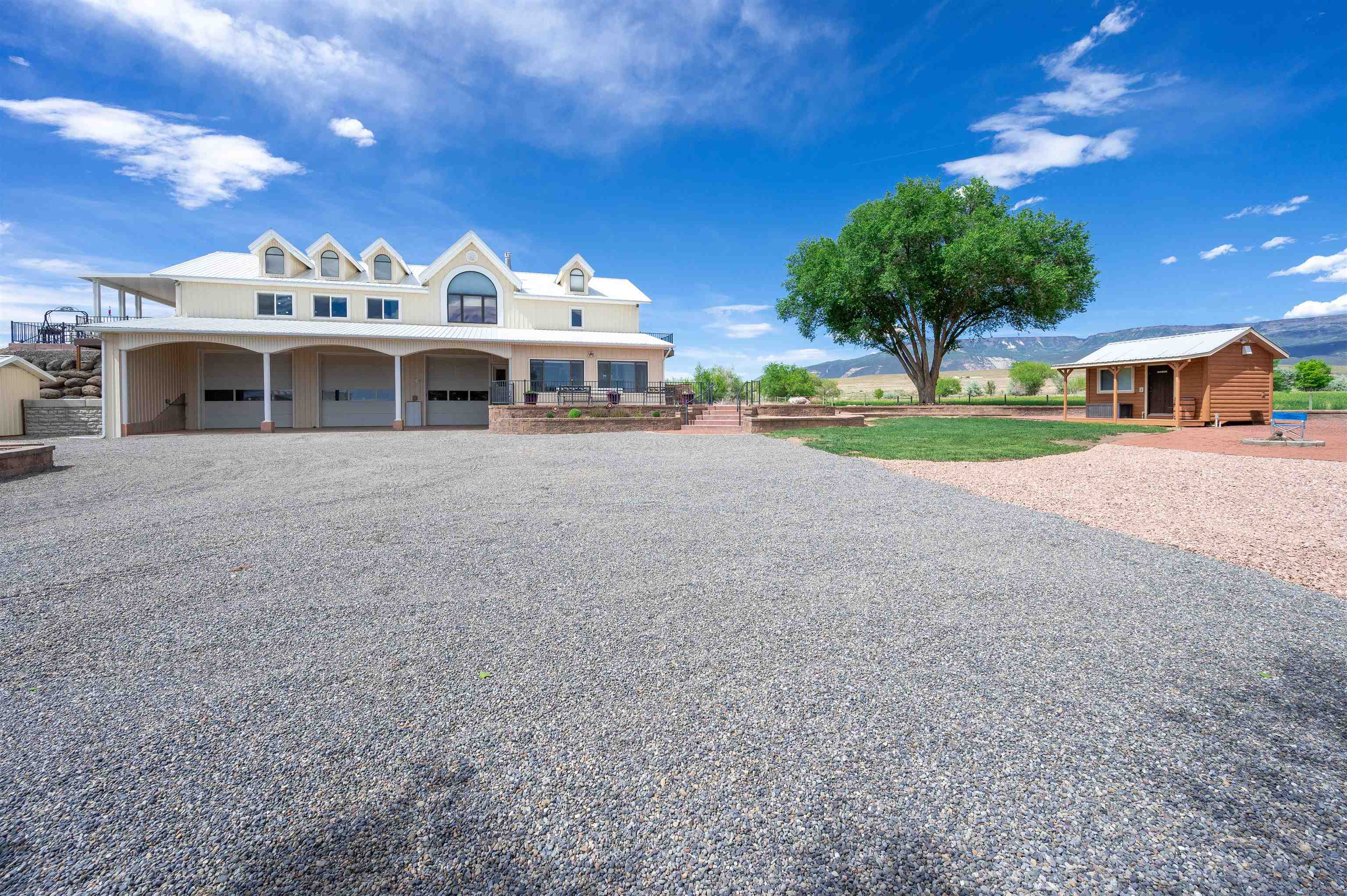 6800 Reeder Mesa Road Whitewater, CO 81527 - Photo 27 of 38 a view of a house with a yard and potted plants