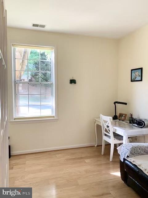 7037 Haycock Road, Unit A Falls Church, VA 22043 - Photo 6 of 10 a view of a workspace with furniture and a window