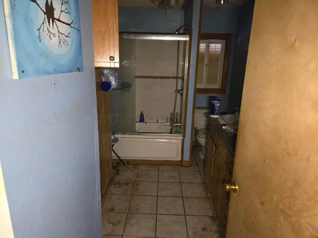 a bathroom with a toilet and a sink