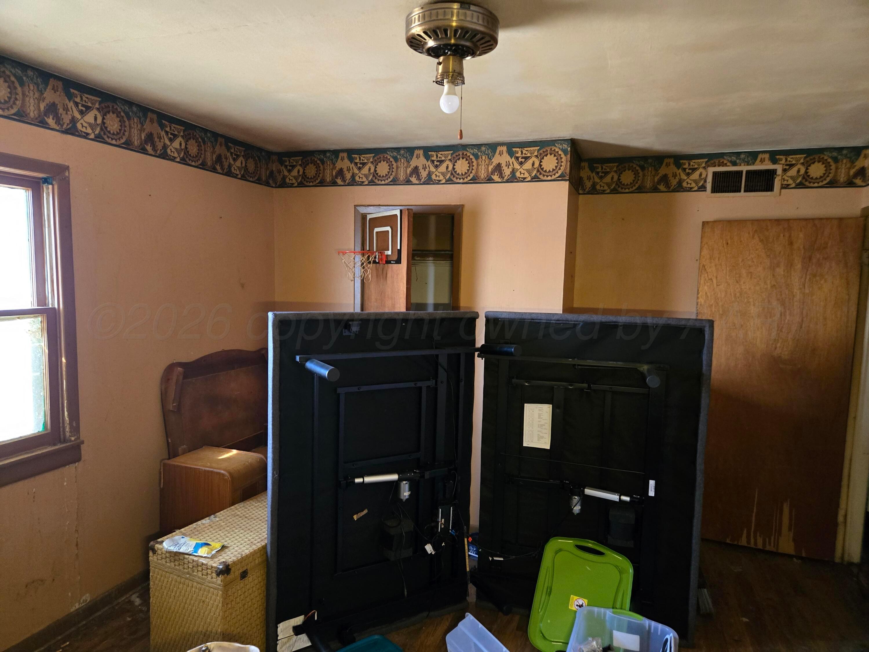 421 North 8th Street Memphis, TX 79245 - Photo 16 of 40 a bathroom with a toilet and a sink
