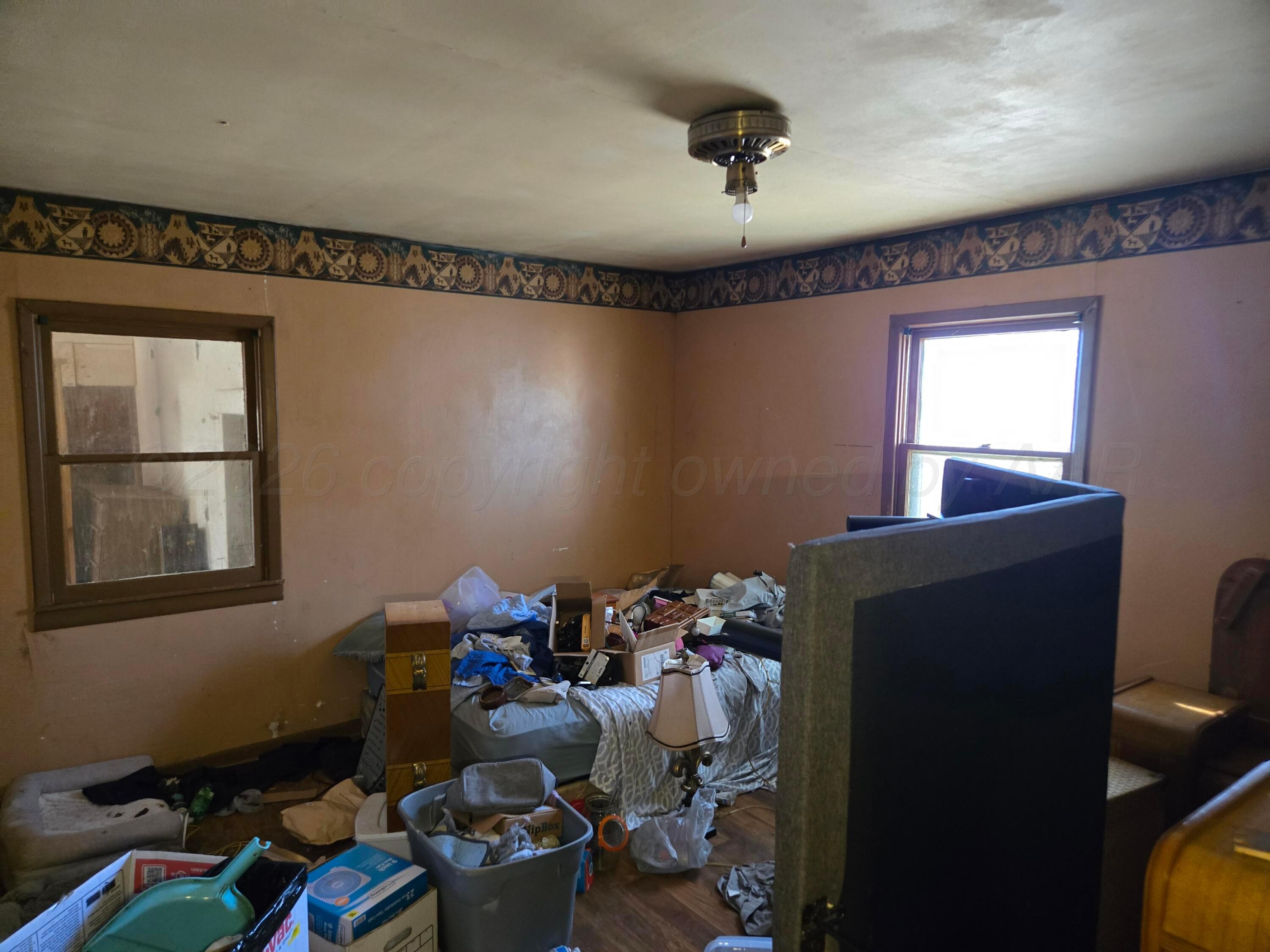 421 North 8th Street Memphis, TX 79245 - Photo 18 of 40 a room with toys and wooden floor
