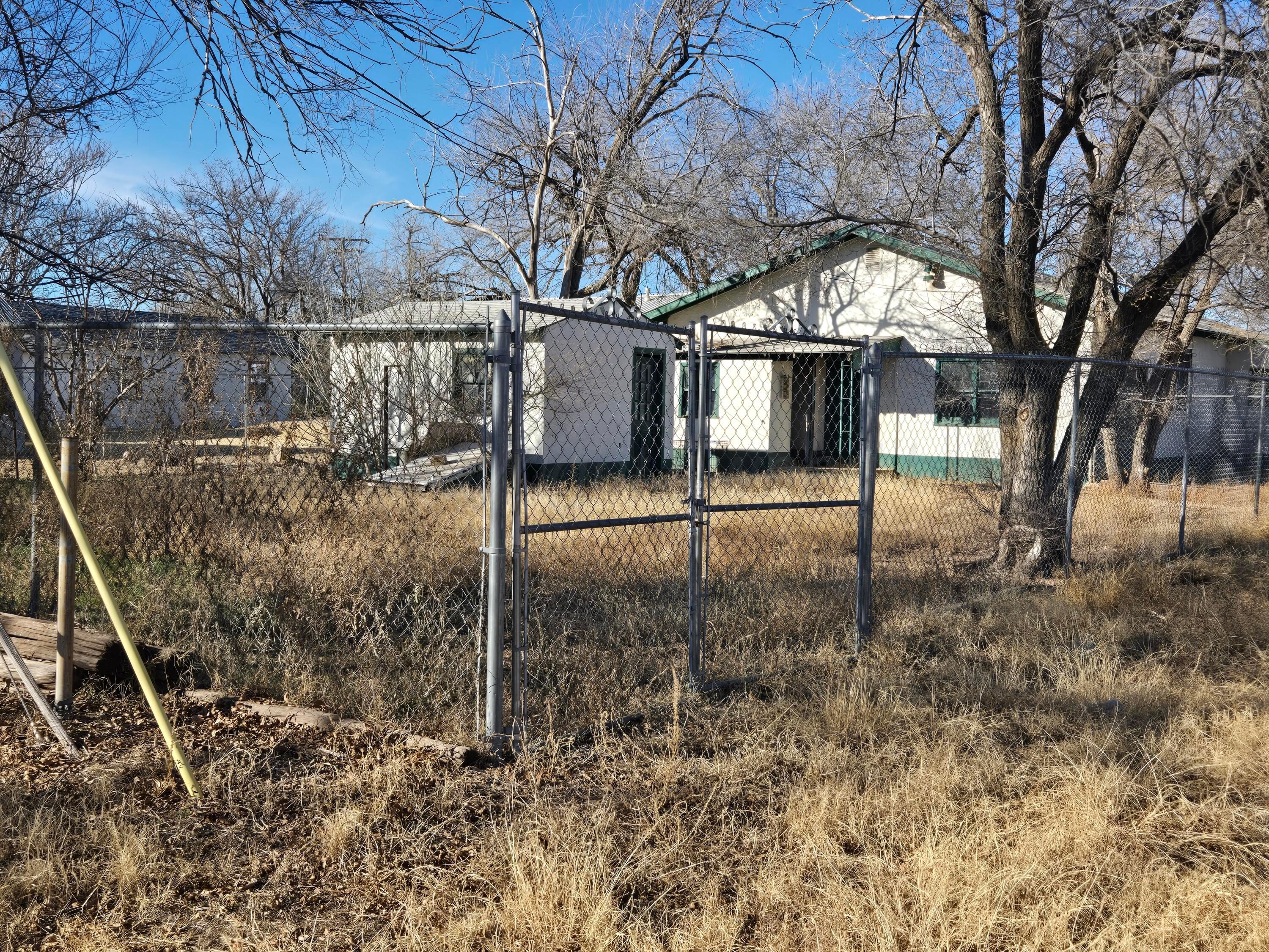 421 North 8th Street Memphis, TX 79245 - Photo 3 of 40 a view of a tiny house with a yard