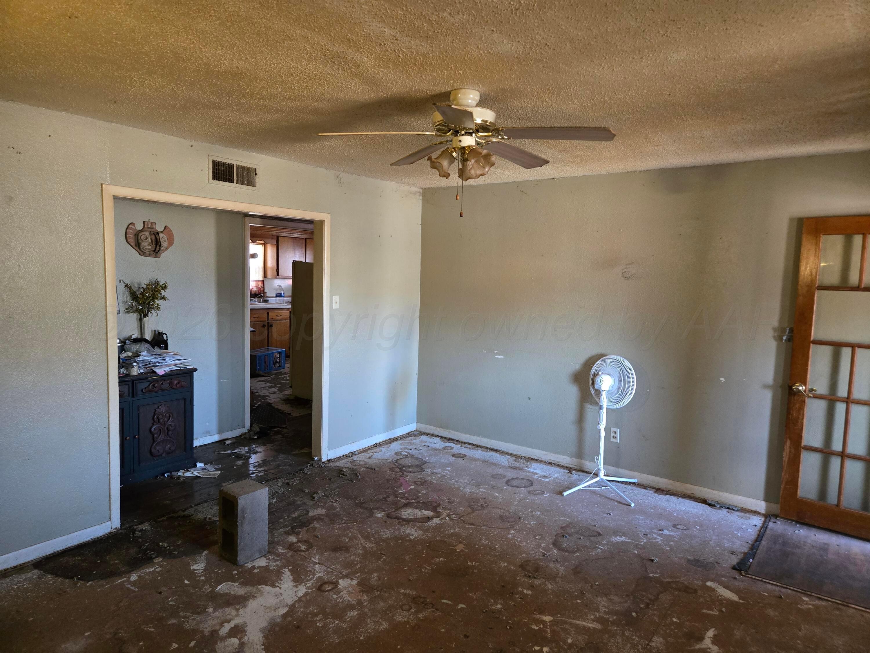 421 North 8th Street Memphis, TX 79245 - Photo 6 of 40 wooden floor in an empty room with a window