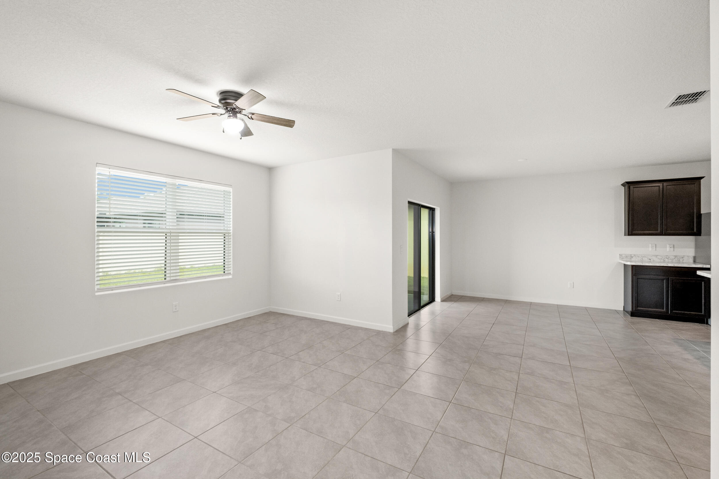 4641 Talbot Boulevard Cocoa, FL 32926 - Photo 4 of 14 a view of an empty room with a window