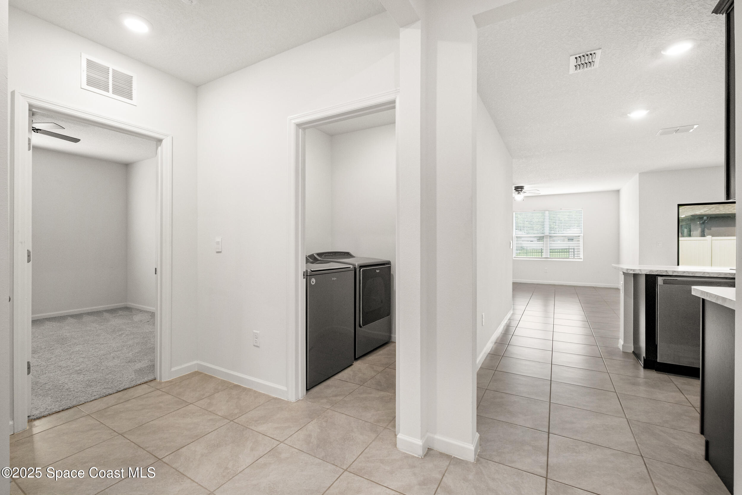 4641 Talbot Boulevard Cocoa, FL 32926 - Photo 8 of 14 a view of hallway with cabinets