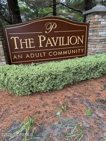 a view of outdoor space with sign board and yard