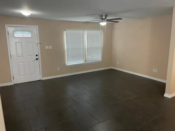 a view of an empty room with a window