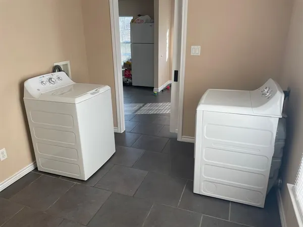 a utility room with dryer and washer