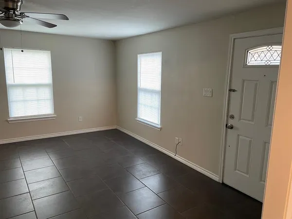 a view of an empty room with a window