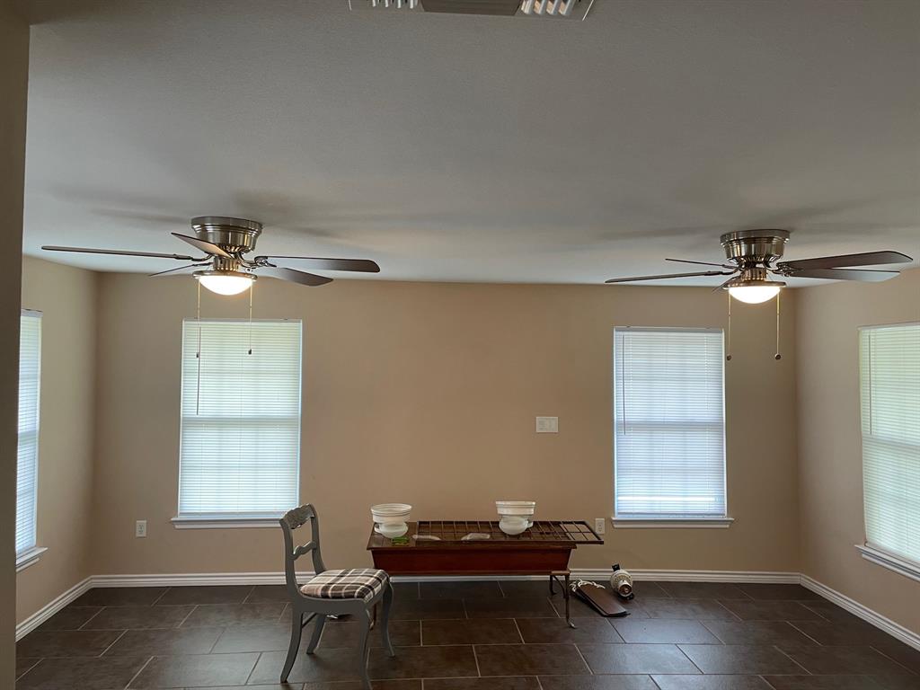 1610 Newsom Mound Road Springtown, TX 76082 - Photo 32 of 40 a living room with furniture and a window