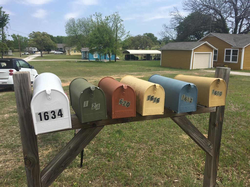 1610 Newsom Mound Road Springtown, TX 76082 - Photo 40 of 40 a front view of a house with garden