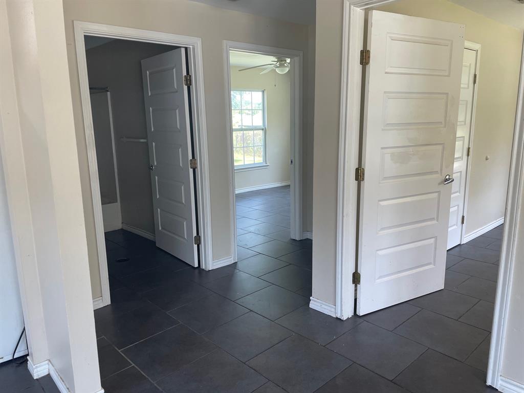 1610 Newsom Mound Road Springtown, TX 76082 - Photo 4 of 40 an empty room with wooden floor