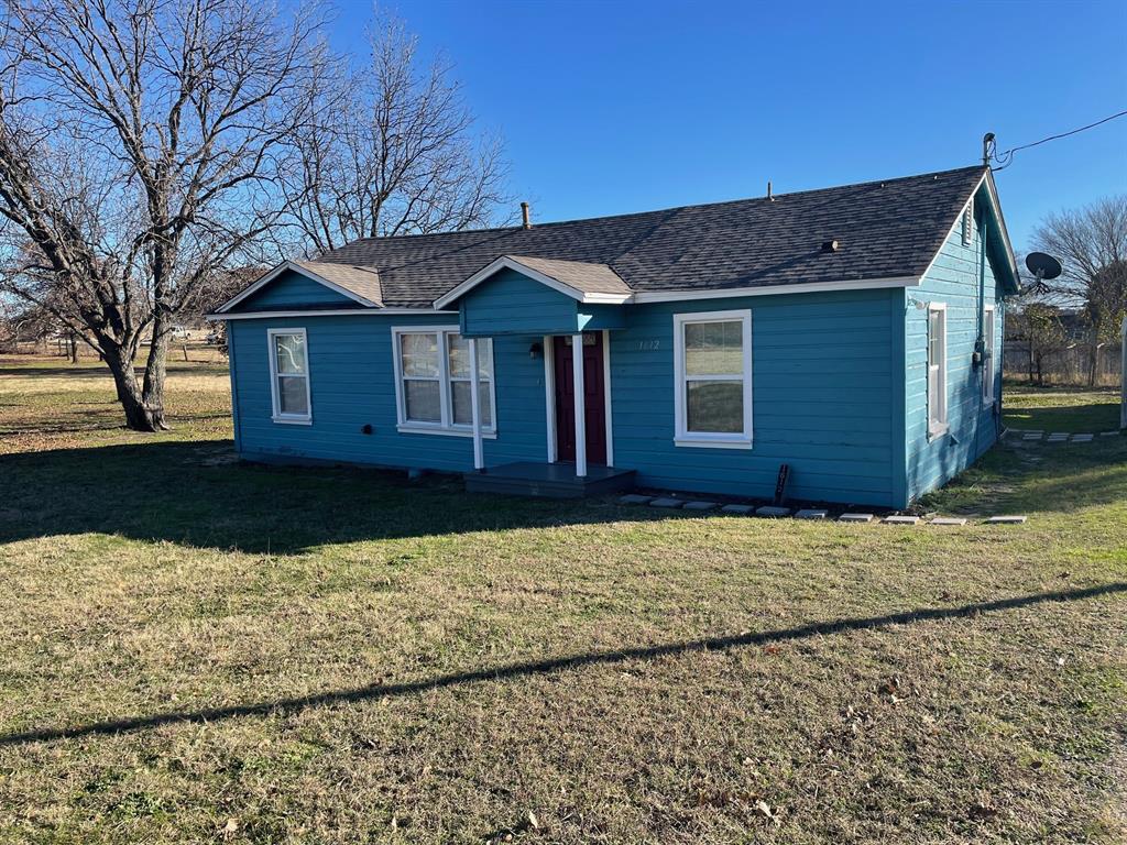 1610 Newsom Mound Road Springtown, TX 76082 - Photo 9 of 40 a front view of a house with a yard