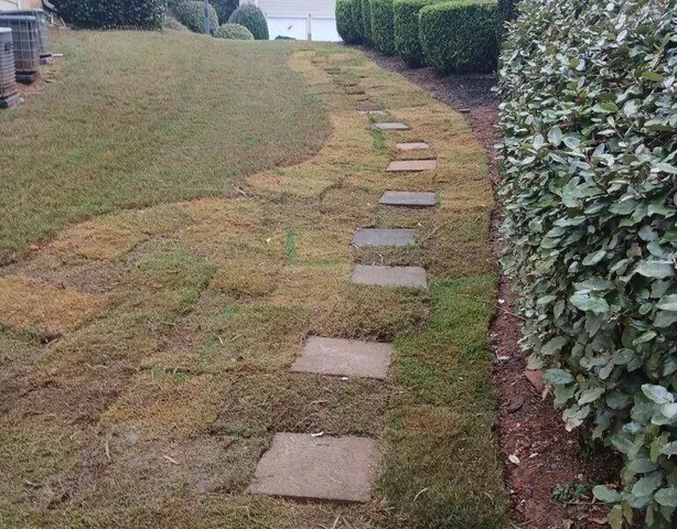 a kitchen with kitchen island sink and cabinets