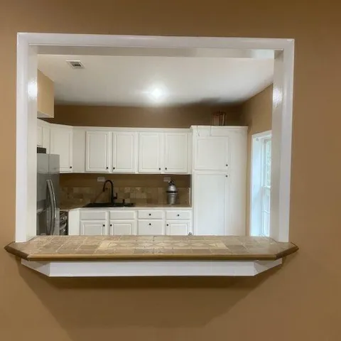 a view of an empty room with a window