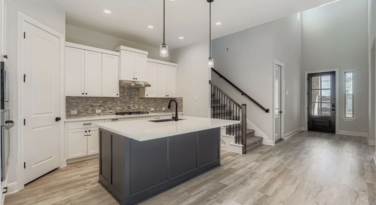 553 Prickly Poppy Loop Kyle, TX 78640 - Photo 6 of 11 a kitchen with a sink a counter top space appliances and cabinets