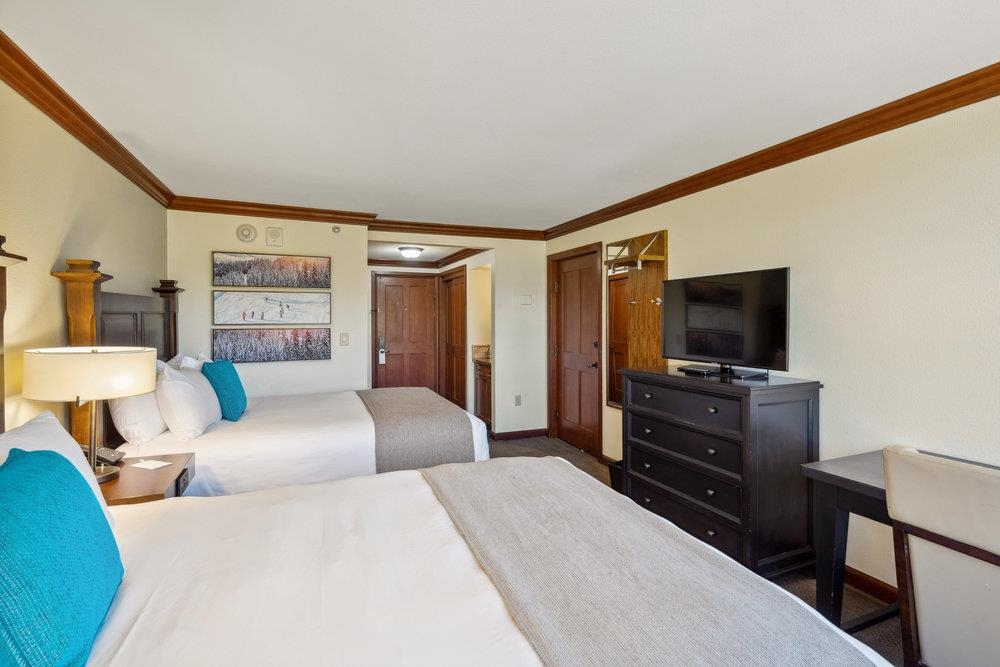 400 Resort Road, Unit 710712 Olympic Valley, CA 96146 - Photo 27 of 28 a bedroom with a bed and a flat screen tv