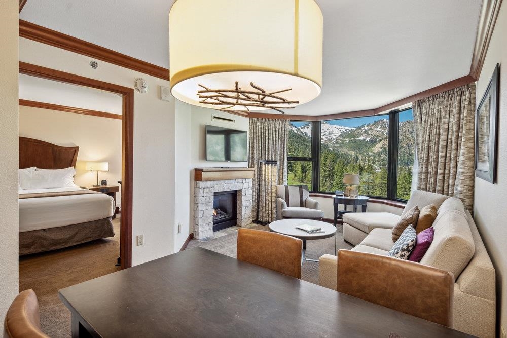 400 Resort Road, Unit 710712 Olympic Valley, CA 96146 - Photo 4 of 28 a living room with furniture and a fireplace