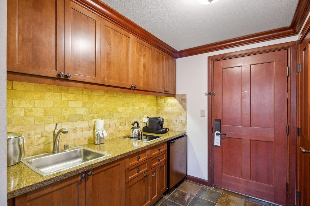 400 Resort Road, Unit 710712 Olympic Valley, CA 96146 - Photo 5 of 28 a kitchen with a sink and cabinets