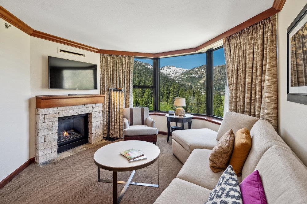 400 Resort Road, Unit 710712 Olympic Valley, CA 96146 - Photo 8 of 28 a living room with furniture and a fireplace