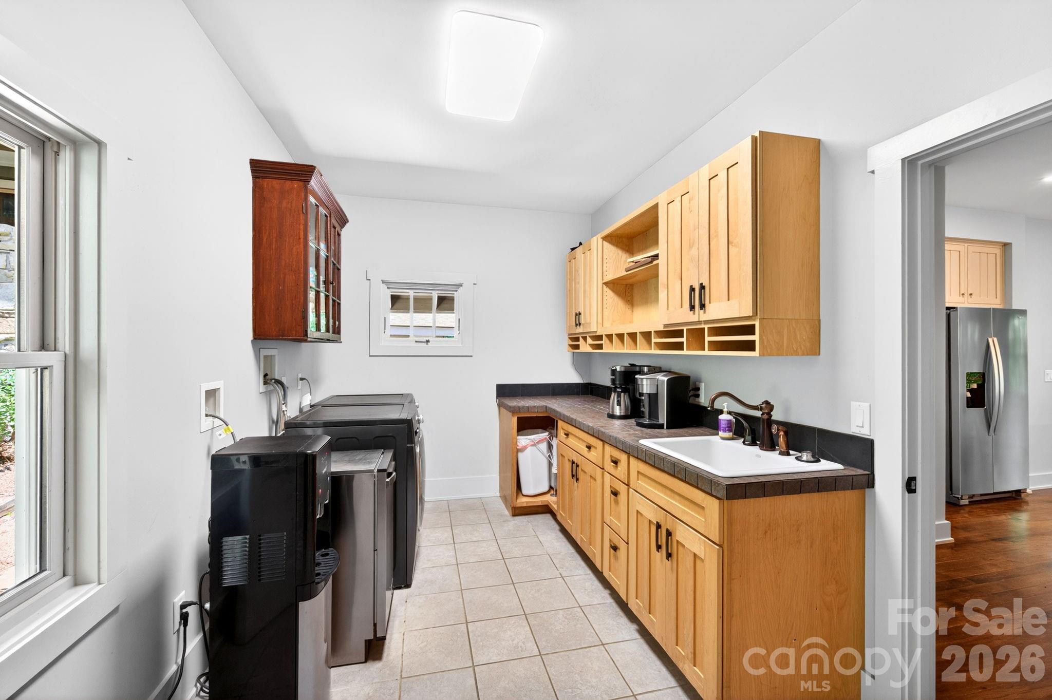 235 Bull Creek Road Asheville, NC 28805 - Photo 29 of 47 a kitchen with stainless steel appliances a stove a sink and a refrigerator