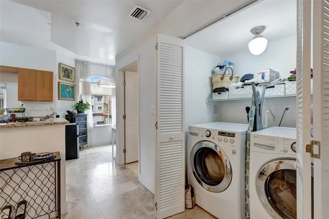 a view of a kitchen and washer and dryer