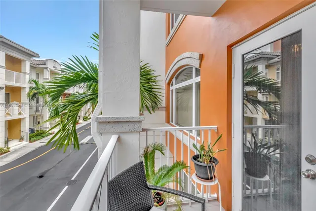 a front view of a house with outdoor seating