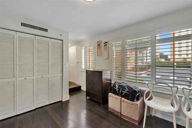 a view of a livingroom with furniture and windows