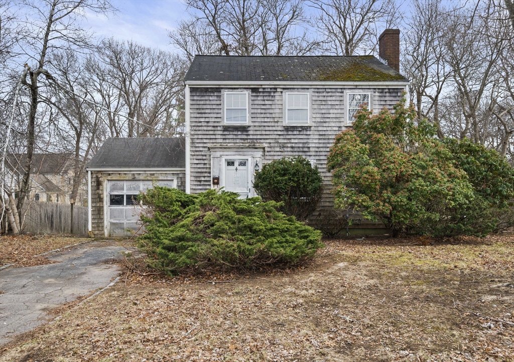 24 Butler Road Hingham, MA 02043 - Photo 1 of 38 a front view of a house with garden