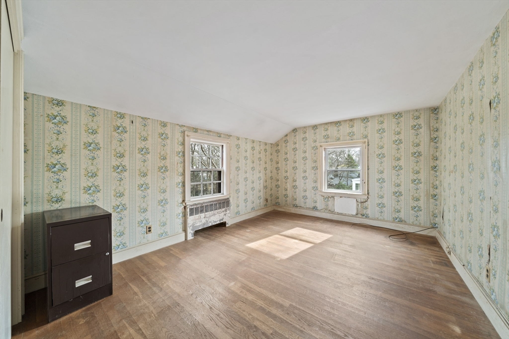 24 Butler Road Hingham, MA 02043 - Photo 14 of 38 wooden floor in an empty room with a window