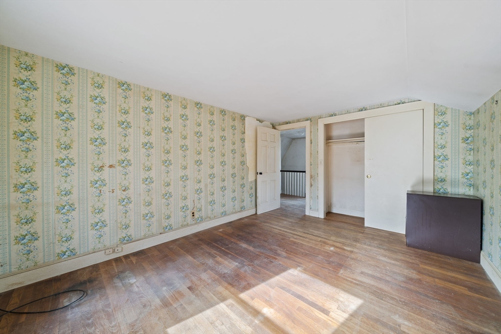 24 Butler Road Hingham, MA 02043 - Photo 15 of 38 a view of an empty room with wooden floor