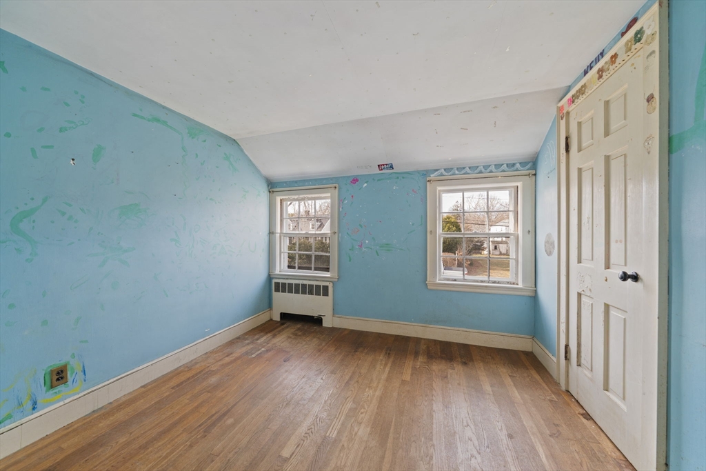24 Butler Road Hingham, MA 02043 - Photo 16 of 38 an empty room with wooden floor and windows