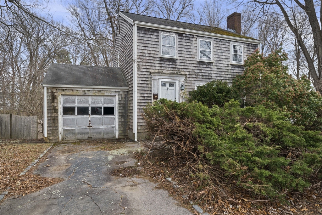 24 Butler Road Hingham, MA 02043 - Photo 2 of 38 a view of a house with a yard