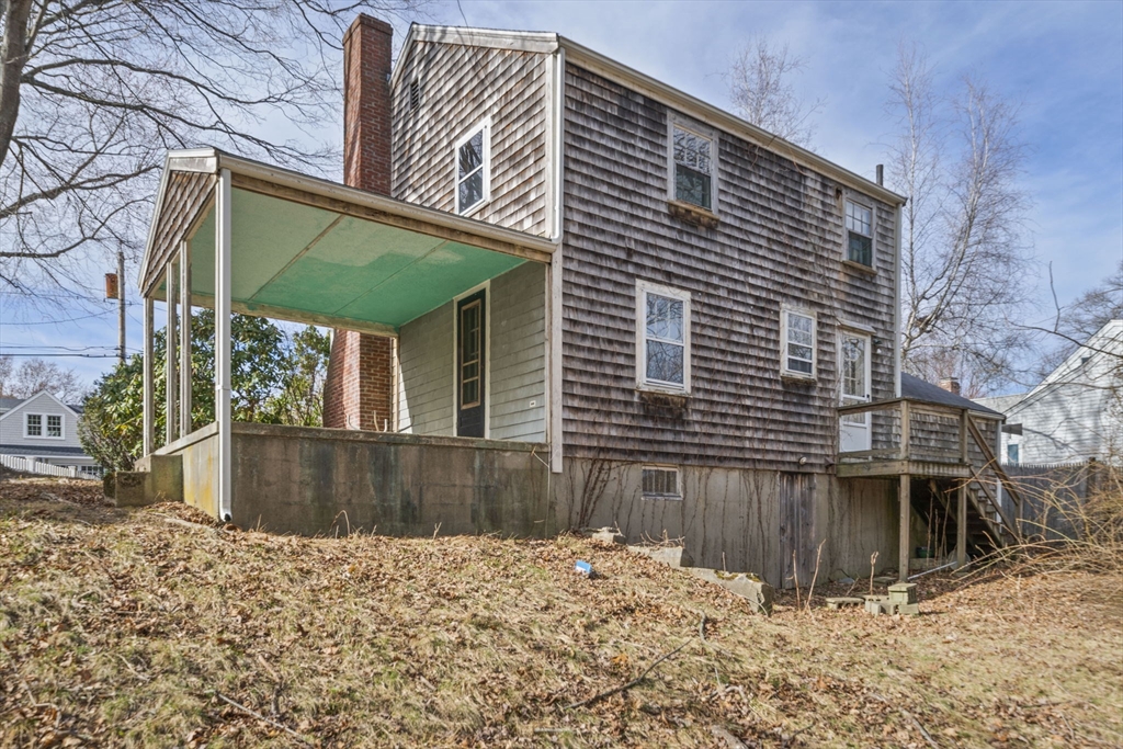 24 Butler Road Hingham, MA 02043 - Photo 22 of 38 a view of a house with a yard