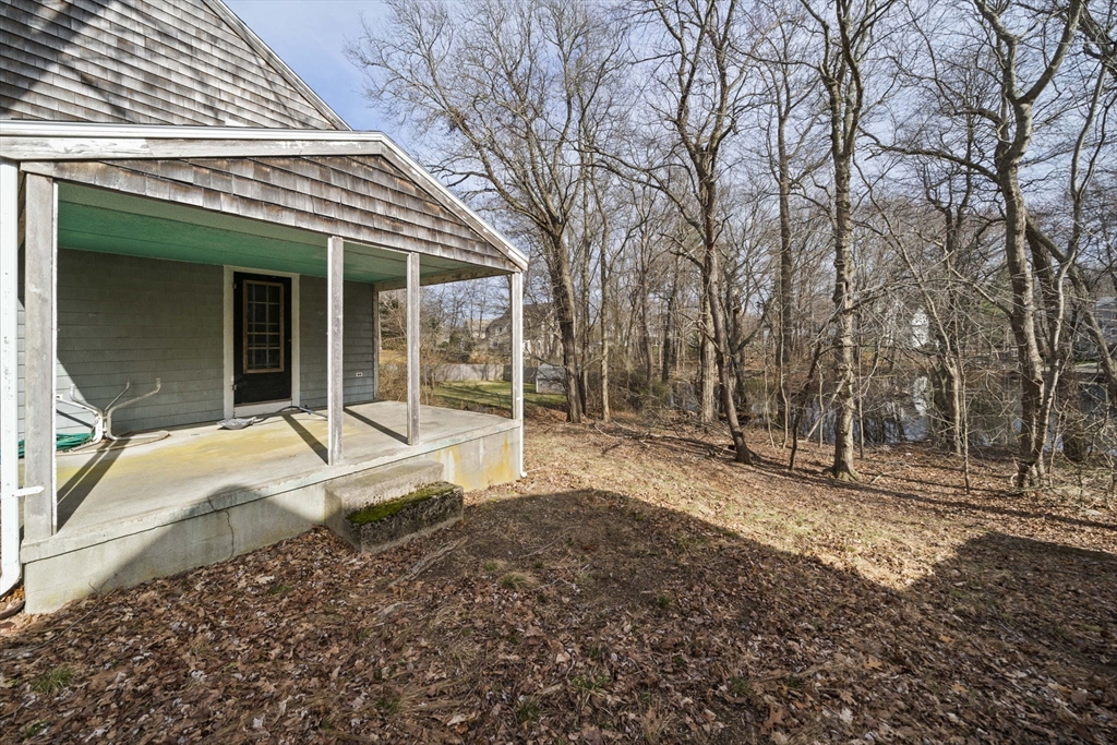 24 Butler Road Hingham, MA 02043 - Photo 23 of 38 a house with trees in front of it