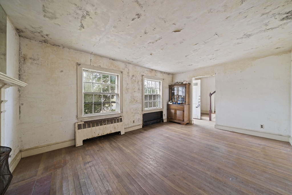 24 Butler Road Hingham, MA 02043 - Photo 9 of 38 an empty room with wooden floor and windows