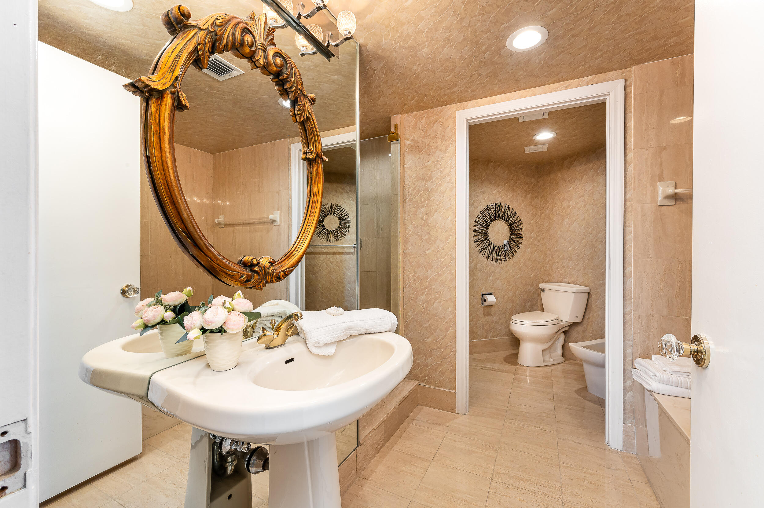 120 Southeast 5th Avenue, Unit PH22 Boca Raton, FL 33432 - Photo 15 of 32 a bathroom with a sink and a mirror