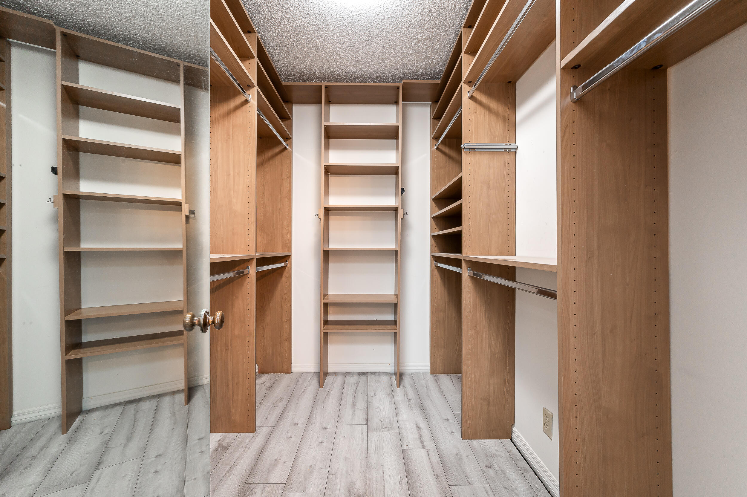 120 Southeast 5th Avenue, Unit PH22 Boca Raton, FL 33432 - Photo 16 of 32 a view of walk in closet with empty racks