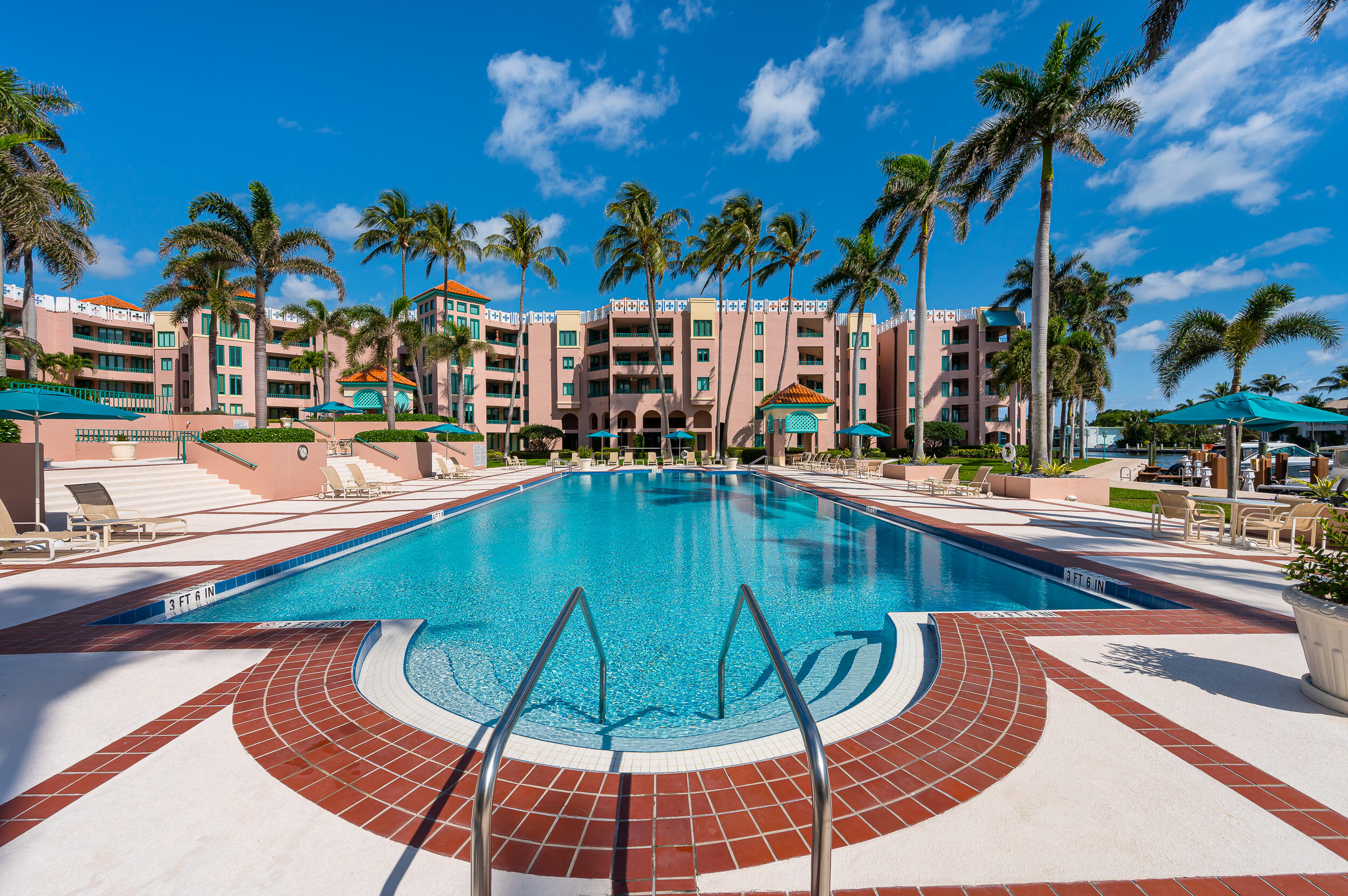 120 Southeast 5th Avenue, Unit PH22 Boca Raton, FL 33432 - Photo 26 of 32 a view of a swimming pool with lounge chairs