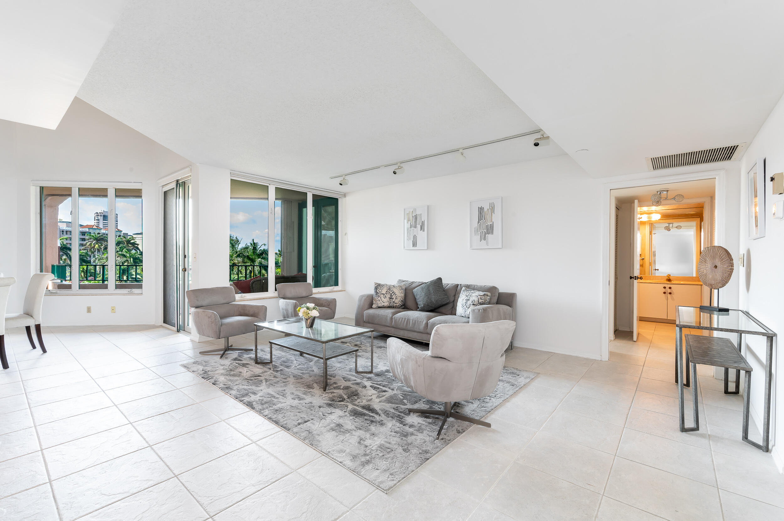 120 Southeast 5th Avenue, Unit PH22 Boca Raton, FL 33432 - Photo 3 of 32 a living room with furniture and a large window