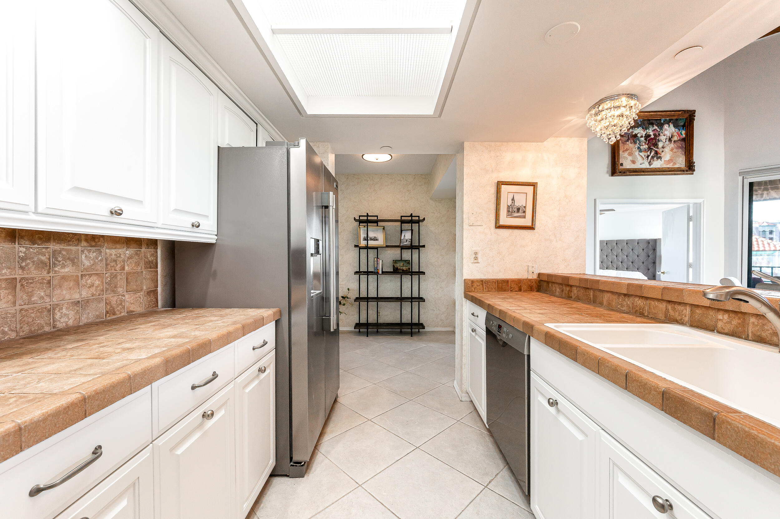 120 Southeast 5th Avenue, Unit PH22 Boca Raton, FL 33432 - Photo 8 of 32 a kitchen with stainless steel appliances granite countertop a sink and cabinets