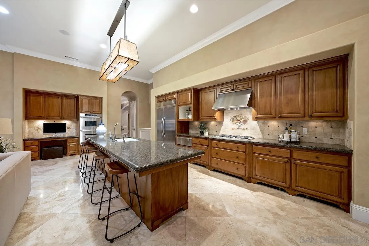 16644 Valle Verde Road Poway, CA 92064 - Photo 18 of 37 a kitchen with granite countertop cabinets a counter space a sink and appliances