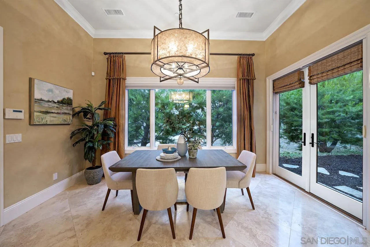 16644 Valle Verde Road Poway, CA 92064 - Photo 19 of 37 a view of a dining room with furniture wooden floor and a chandelier