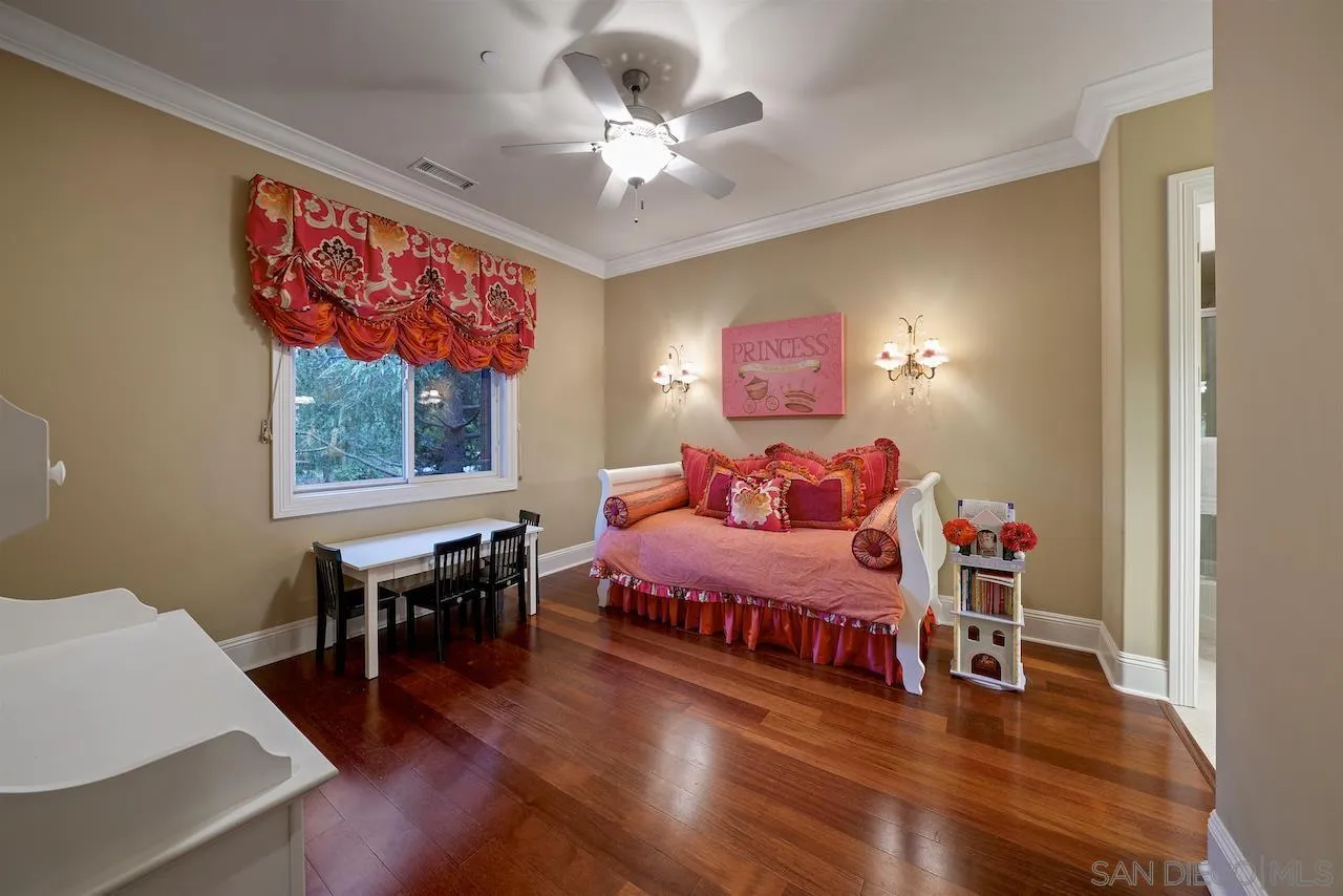 16644 Valle Verde Road Poway, CA 92064 - Photo 27 of 37 a spacious bedroom with a bed and a table in it