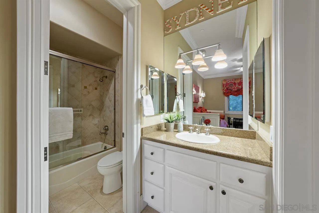 16644 Valle Verde Road Poway, CA 92064 - Photo 28 of 37 a bathroom with a sink a toilet and shower