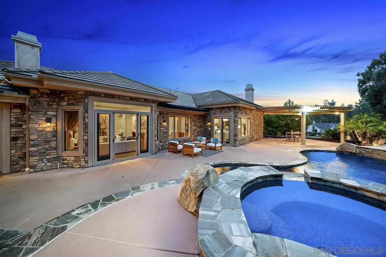 16644 Valle Verde Road Poway, CA 92064 - Photo 10 of 37 a view of a patio with couches and table and chairs with wooden floor and fence