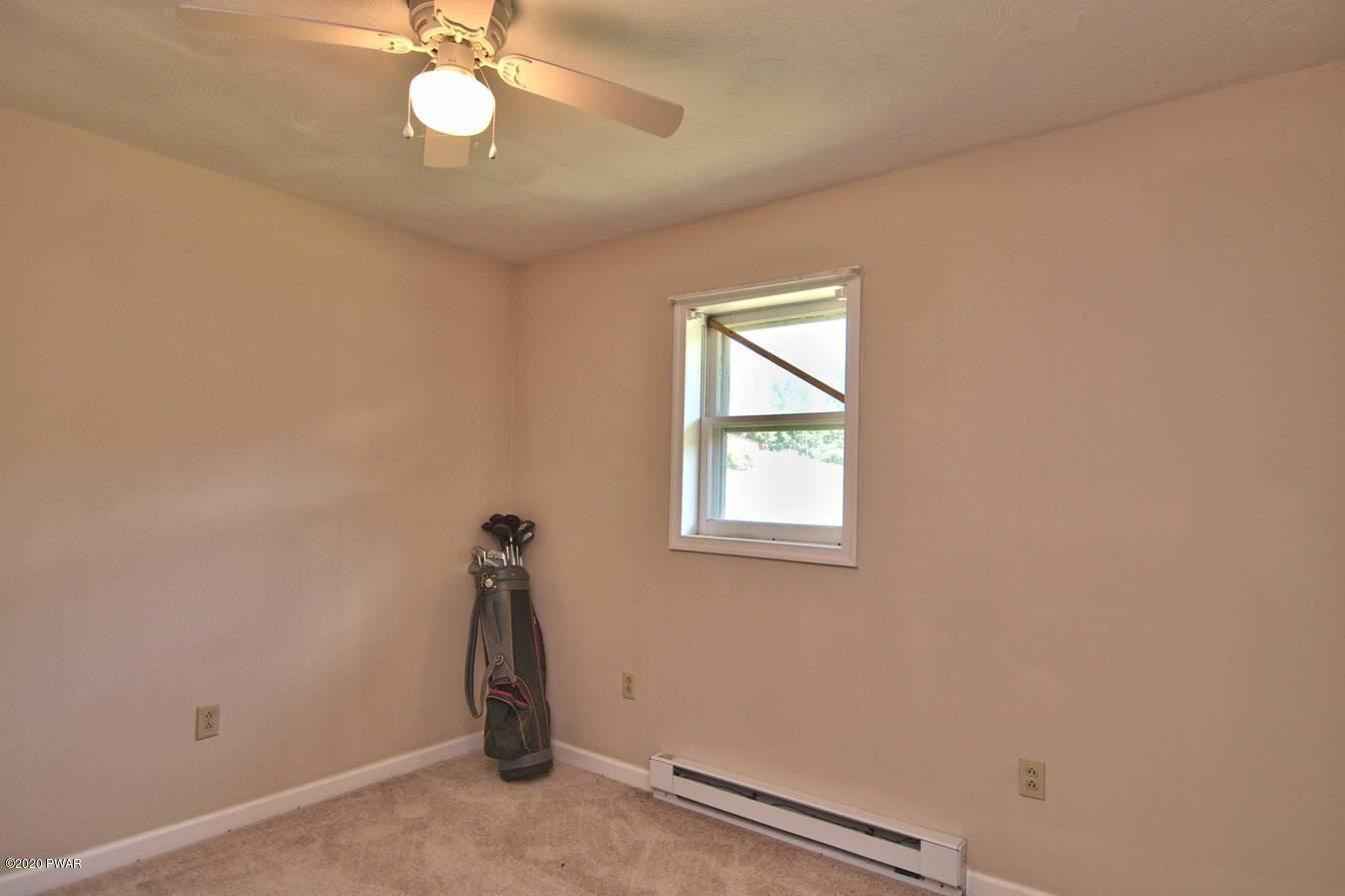 5690 Haas Pond Road Moscow, PA 18444 - Photo 39 of 79 an empty room with windows
