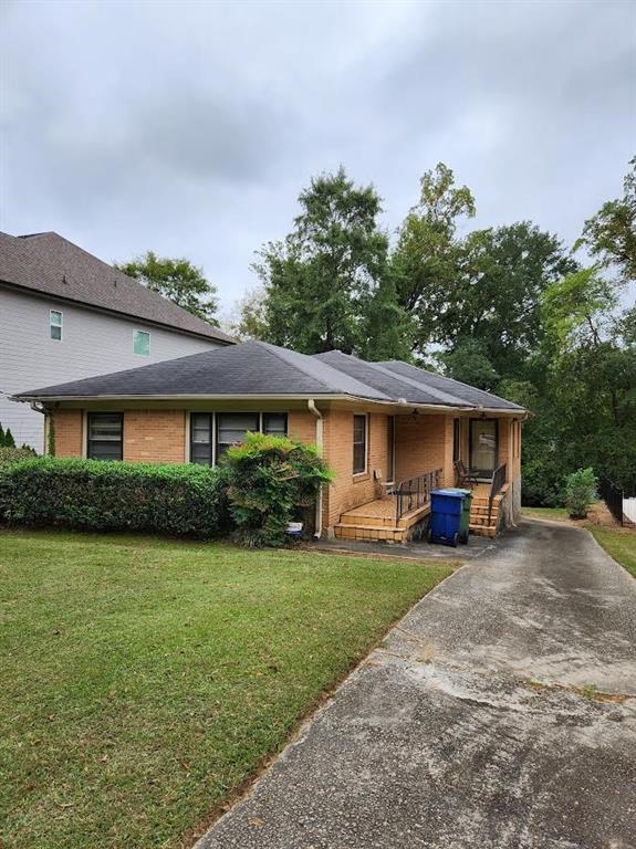 451 Wimbledon Road Northeast Atlanta, GA 30324 - Photo 1 of 1 a view of a yard in front of a house